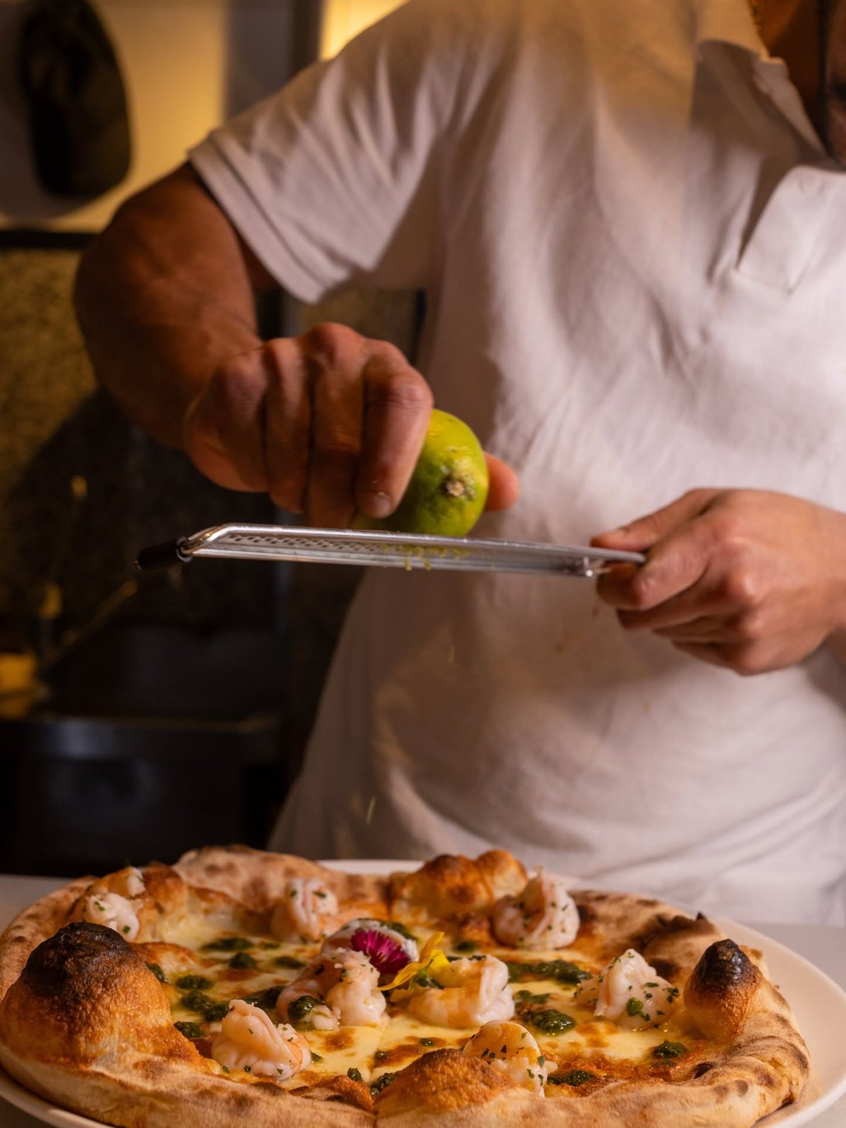 Lime zested over a prawn and pesto pizza