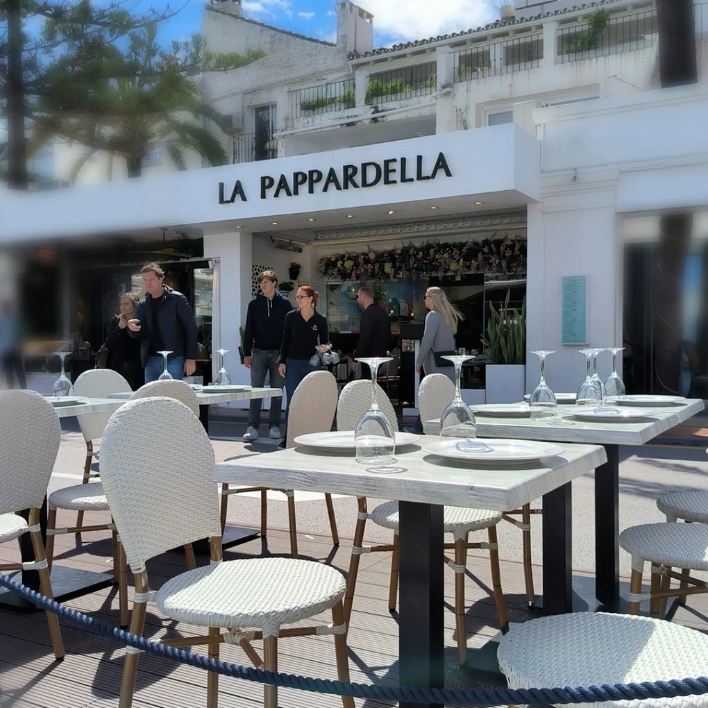 La Pappardella from the promenade, tables laid, staff at the door