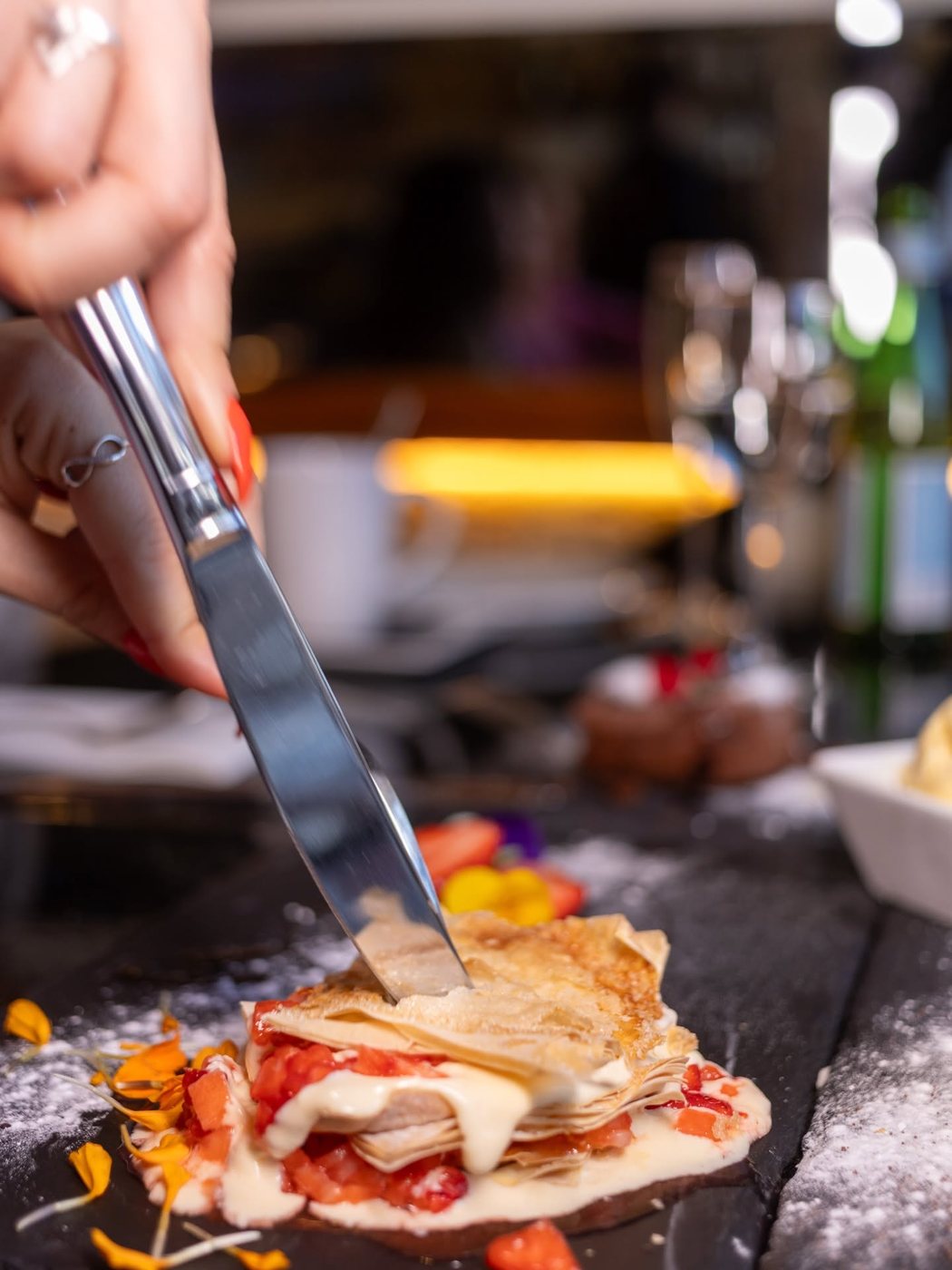 Millefoglie being cut, custard and strawberry tartare
