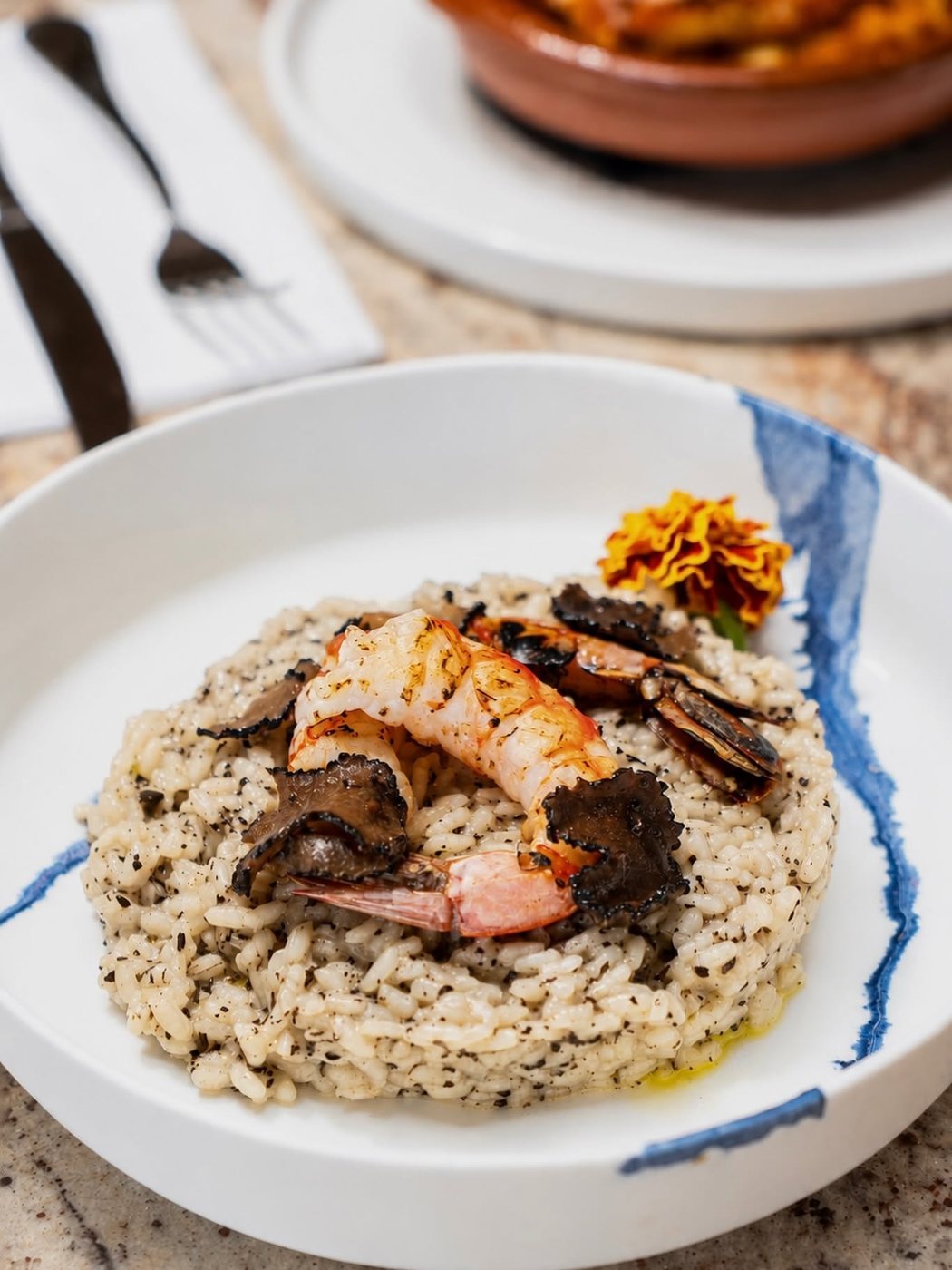 Creamy risotto with black truffle and king prawns